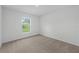 Bright bedroom featuring neutral walls and carpeted floor at 310 Amberjack Ln, Poinciana, FL 34759