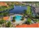 Resort-style community pool and lakefront setting at 4753 Vero Beach Pl, Kissimmee, FL 34746