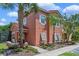 Two-story townhome showcasing a well-maintained exterior and landscaping at 4753 Vero Beach Pl, Kissimmee, FL 34746