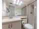 Bathroom featuring shower with glass doors, tile floors, and modern fixtures at 101 N Grandview St # 312, Mount Dora, FL 32757