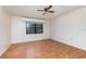 Spacious bedroom with wood flooring and ceiling fan at 101 N Grandview St # 312, Mount Dora, FL 32757