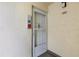 Condo unit's front door with security features at 101 N Grandview St # 312, Mount Dora, FL 32757