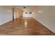 Bright living room with wood floors and an open layout to the kitchen at 101 N Grandview St # 312, Mount Dora, FL 32757