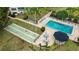 Relaxing pool area with shuffleboard and picnic tables at 101 N Grandview St # 312, Mount Dora, FL 32757