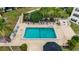 Community pool with surrounding lounge chairs and patio at 101 N Grandview St # 312, Mount Dora, FL 32757