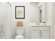 Clean bathroom with white vanity, bathtub, and neutral decor at 2073 Lasso Loop, Eagle Lake, FL 33839