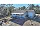 Backyard with covered patio, landscaping, and shed at 3060 Granada Dr, Indian Lake Estates, FL 33855