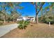 Single-story home with attached garage and landscaping at 3060 Granada Dr, Indian Lake Estates, FL 33855