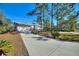 Single-story home with attached garage and landscaping at 3060 Granada Dr, Indian Lake Estates, FL 33855