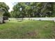 Large backyard with lush lawn and privacy fence at 36320 Piney Ridge Blvd, Fruitland Park, FL 34731