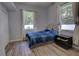 Guest bedroom with wood-look floors and ample natural light at 36320 Piney Ridge Blvd, Fruitland Park, FL 34731