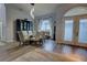 Elegant dining room with glass table, patterned chairs, and hardwood floors at 36320 Piney Ridge Blvd, Fruitland Park, FL 34731