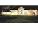 Well-lit house exterior at night, showcasing curb appeal at 36320 Piney Ridge Blvd, Fruitland Park, FL 34731