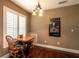 Small breakfast nook with wood table and chairs near window at 7006 Arcadian Ct, Mount Dora, FL 32757