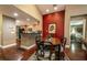 Elegant dining area with dark wood table and access to kitchen at 7006 Arcadian Ct, Mount Dora, FL 32757