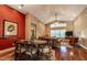 Spacious dining room with hardwood floors and a view into the living room at 7006 Arcadian Ct, Mount Dora, FL 32757