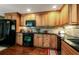 Modern kitchen with black appliances and light wood cabinets at 7006 Arcadian Ct, Mount Dora, FL 32757