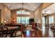 Bright living room featuring hardwood floors, vaulted ceilings and a cozy sitting area at 7006 Arcadian Ct, Mount Dora, FL 32757