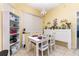 Bright dining area featuring white furniture, light fixtures, and tiled floors at 422 W Division St, Clermont, FL 34715