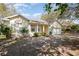 Classic one-story home featuring an attached two-car garage and covered front entry at 422 W Division St, Clermont, FL 34715