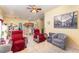 Open-concept living room featuring tiled floors, neutral wall color, and comfortable seating at 422 W Division St, Clermont, FL 34715