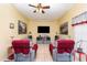 Cozy living room featuring a ceiling fan, tiled floors, and comfortable seating at 422 W Division St, Clermont, FL 34715