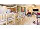 Open concept living space with kitchen, eat-in bar, and furniture at 422 W Division St, Clermont, FL 34715