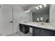 Updated bathroom with double vanity, new flooring, and stylish fixtures at 6821 Rembrandt Dr, Orlando, FL 32818