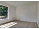 Bright bedroom with large window and neutral carpeting at 6821 Rembrandt Dr, Orlando, FL 32818
