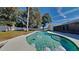 Inviting kidney-shaped pool with large backyard at 6821 Rembrandt Dr, Orlando, FL 32818
