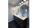 Modern bathroom with double vanity and hexagon tile at 2541 E Lake Dr, Deland, FL 32724