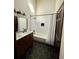 Updated bathroom with subway tile, hexagon floor tile, and a soaking tub at 2541 E Lake Dr, Deland, FL 32724