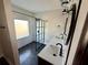 Modern bathroom with double vanity, hexagon tile floors and a glass shower at 2541 E Lake Dr, Deland, FL 32724