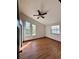 Bright bedroom with hardwood floors, ceiling fan and large windows at 2541 E Lake Dr, Deland, FL 32724