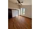 Spacious bedroom with hardwood floors, ceiling fan and large windows at 2541 E Lake Dr, Deland, FL 32724