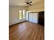 Bright bedroom with hardwood floors, ceiling fan and large windows at 2541 E Lake Dr, Deland, FL 32724