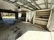 Two-car garage with built-in shelving and workshop area at 2541 E Lake Dr, Deland, FL 32724