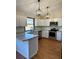Modern kitchen with white cabinets, granite countertops and stainless steel appliances at 2541 E Lake Dr, Deland, FL 32724