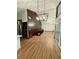 Open living area with wood accent wall, chandelier, and hardwood flooring at 2541 E Lake Dr, Deland, FL 32724