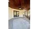 Covered patio with wood ceiling and French doors at 2541 E Lake Dr, Deland, FL 32724