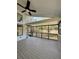 Spacious screened porch overlooks a tranquil backyard view at 2541 E Lake Dr, Deland, FL 32724