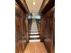 Interior staircase with wood and white tile at 2541 E Lake Dr, Deland, FL 32724