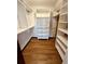 Large walk-in closet with shelving and hanging rods at 2541 E Lake Dr, Deland, FL 32724