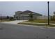 View of home with two car garage, a well-kept lawn and fence at 400 Watusi Way, St Cloud, FL 34772