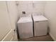 Functional laundry room features a side-by-side washer and dryer at 400 Watusi Way, St Cloud, FL 34772