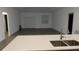 Living room with sliding glass doors, a window, and views into the kitchen at 400 Watusi Way, St Cloud, FL 34772