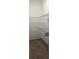 Walk-in pantry with white wire shelving and gray wood-look tile floor at 400 Watusi Way, St Cloud, FL 34772