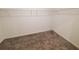 Walk-in closet with carpet flooring and white shelving with lots of storage space at 400 Watusi Way, St Cloud, FL 34772