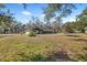 Spacious backyard with trampoline and large trees at 5525 Tillman Rd, Lakeland, FL 33810