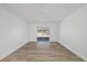 Spacious living room featuring wood-look flooring and ceiling fan at 5525 Tillman Rd, Lakeland, FL 33810